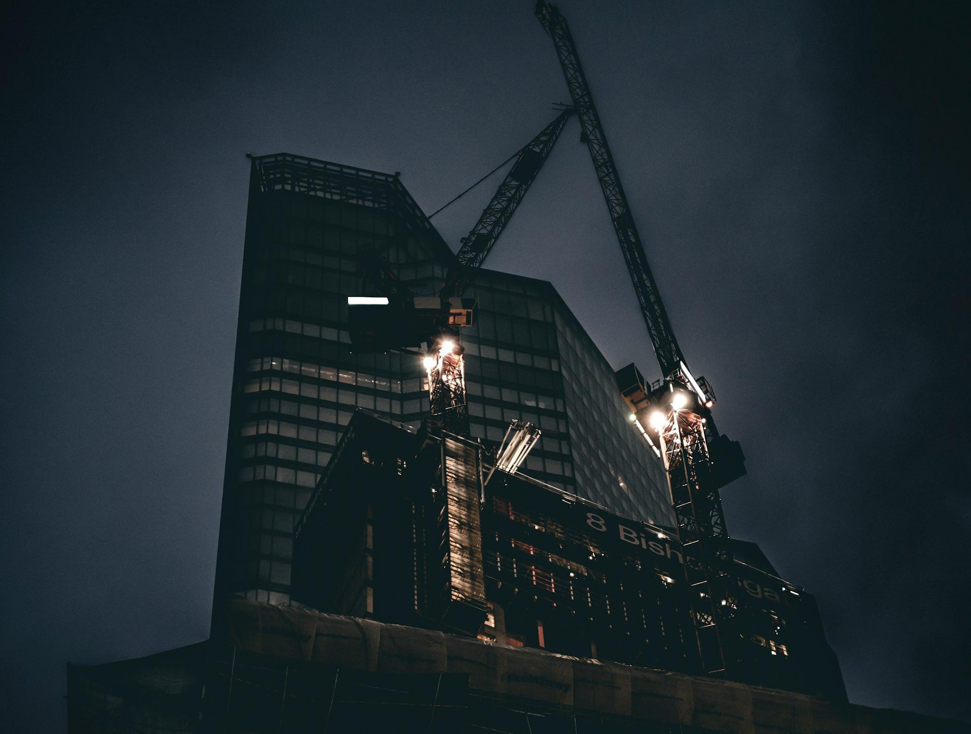 a very tall building with a crane on top of it
